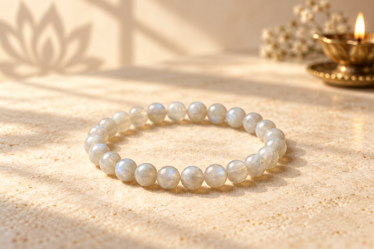 Nityara Moonstone bracelet showing soft blue adularescence in warm natural light