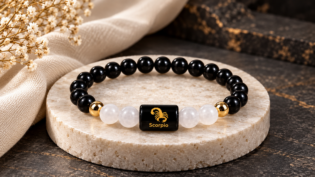 Scorpio Black Obsidian and Milky Quartz bracelet styled on ivory stone against a charcoal background