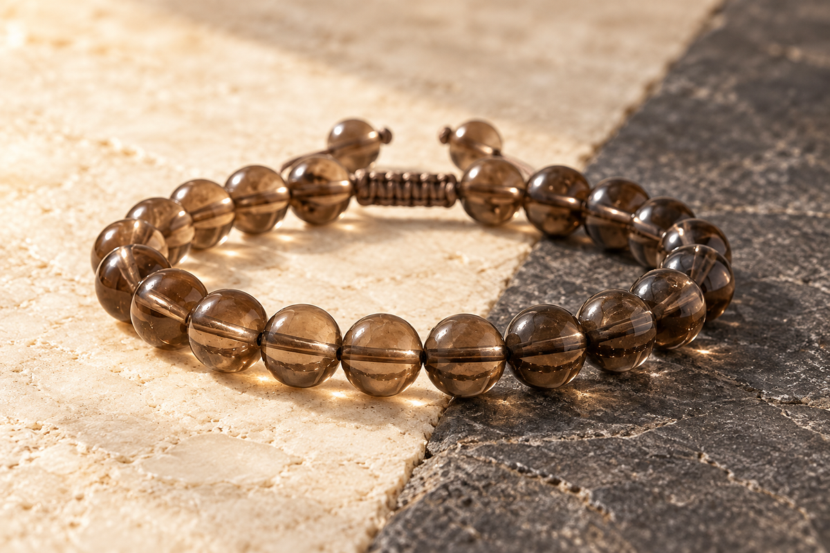Number 4 Smoky Quartz bracelet showing translucent tea-brown and deep smoky tones across ivory and charcoal stone