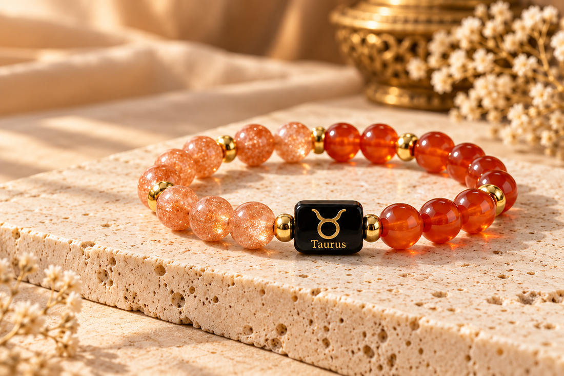 Taurus Sunstone and Carnelian zodiac band on warm ivory stone
