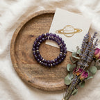 Capricorn Saturn Zodiac Bracelet styled flat-lay with astrology props