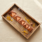 5-piece copper pyramid set styled flat-lay