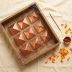 Copper pyramid set styled flat-lay