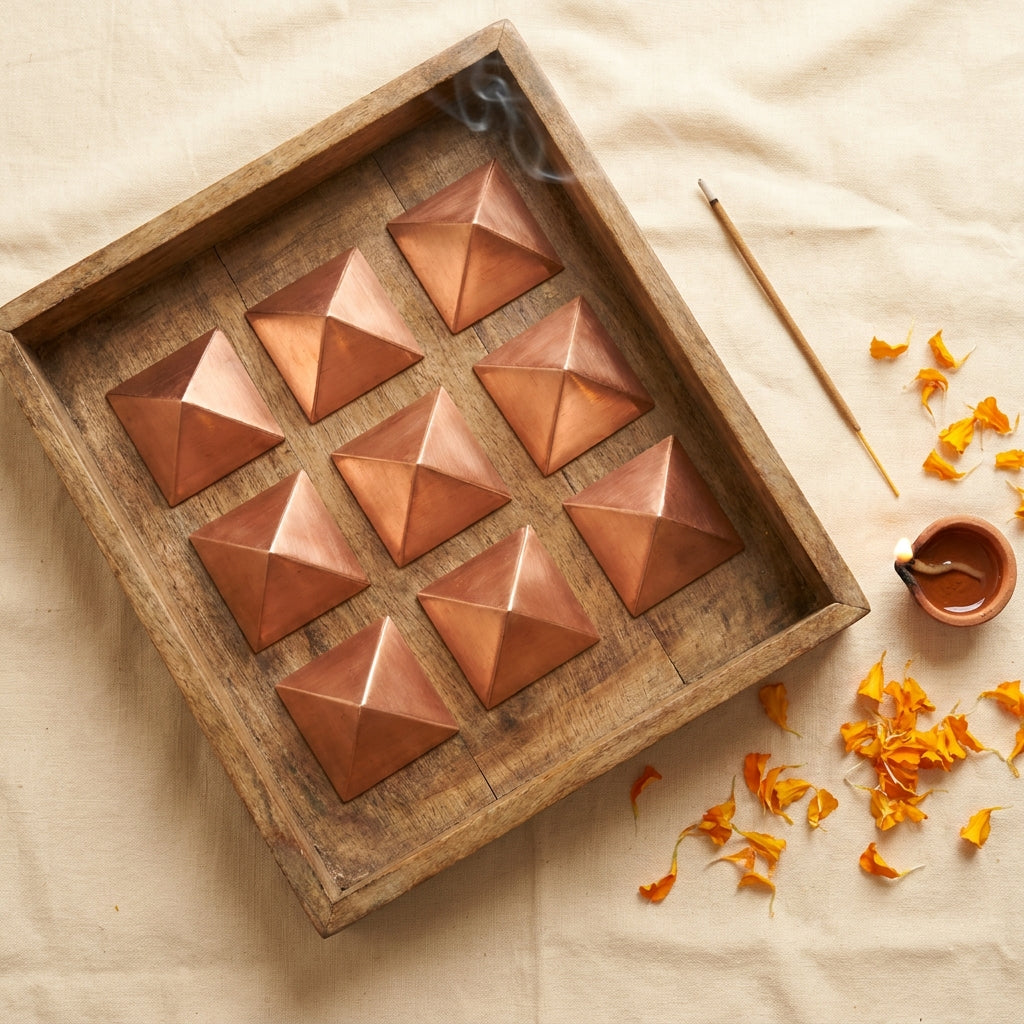 Copper pyramid set styled flat-lay
