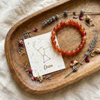 Aries & Scorpio Mars Zodiac Bracelet styled flat-lay with astrology props