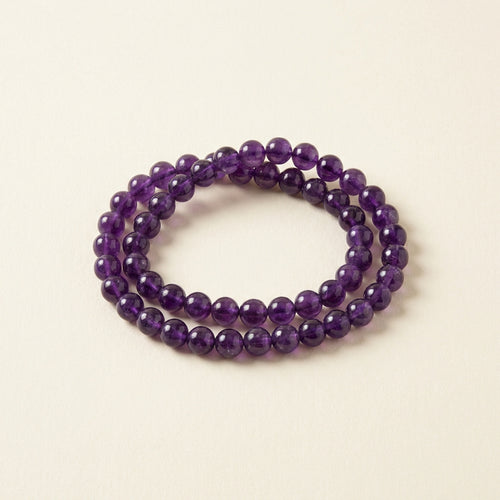 Aquarius Saturn Zodiac Bracelet - amethyst beads hero shot