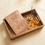 Copper Shree Yantra wall plate styled flat-lay