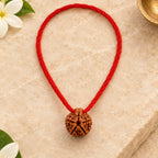 5 Mukhi Rudraksha Thread Pendant top view on warm ivory stone
