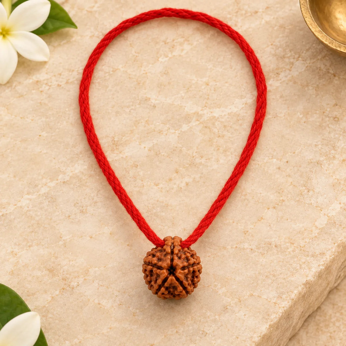 5 Mukhi Rudraksha Thread Pendant top view on warm ivory stone