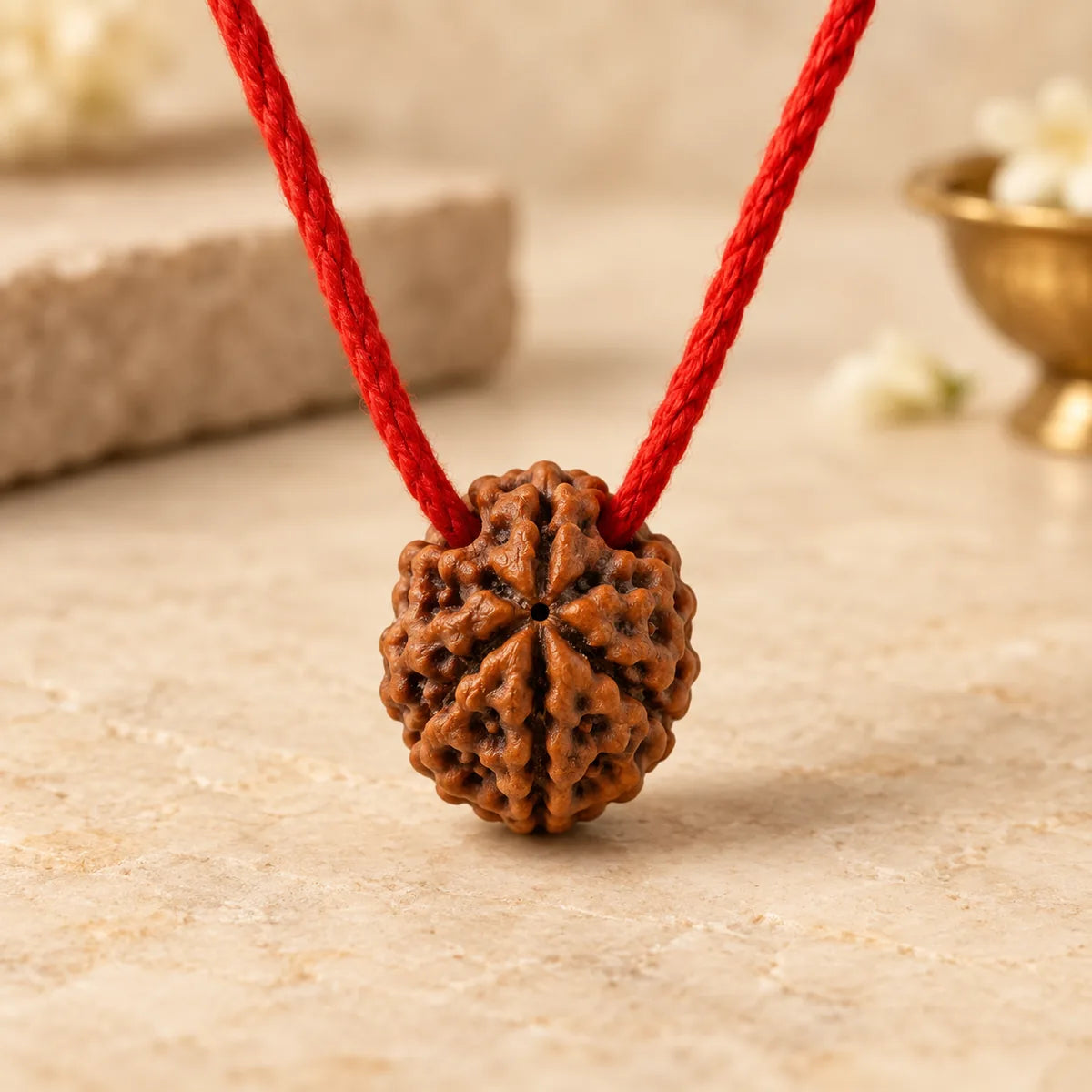 Nityara 7 Mukhi Rudraksha Thread Pendant on sacred red thread