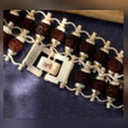 Silver Plated Modern Rudraksha Link Bracelet close-up showing the rectangular clasp and silver lattice around dark Rudraksha beads